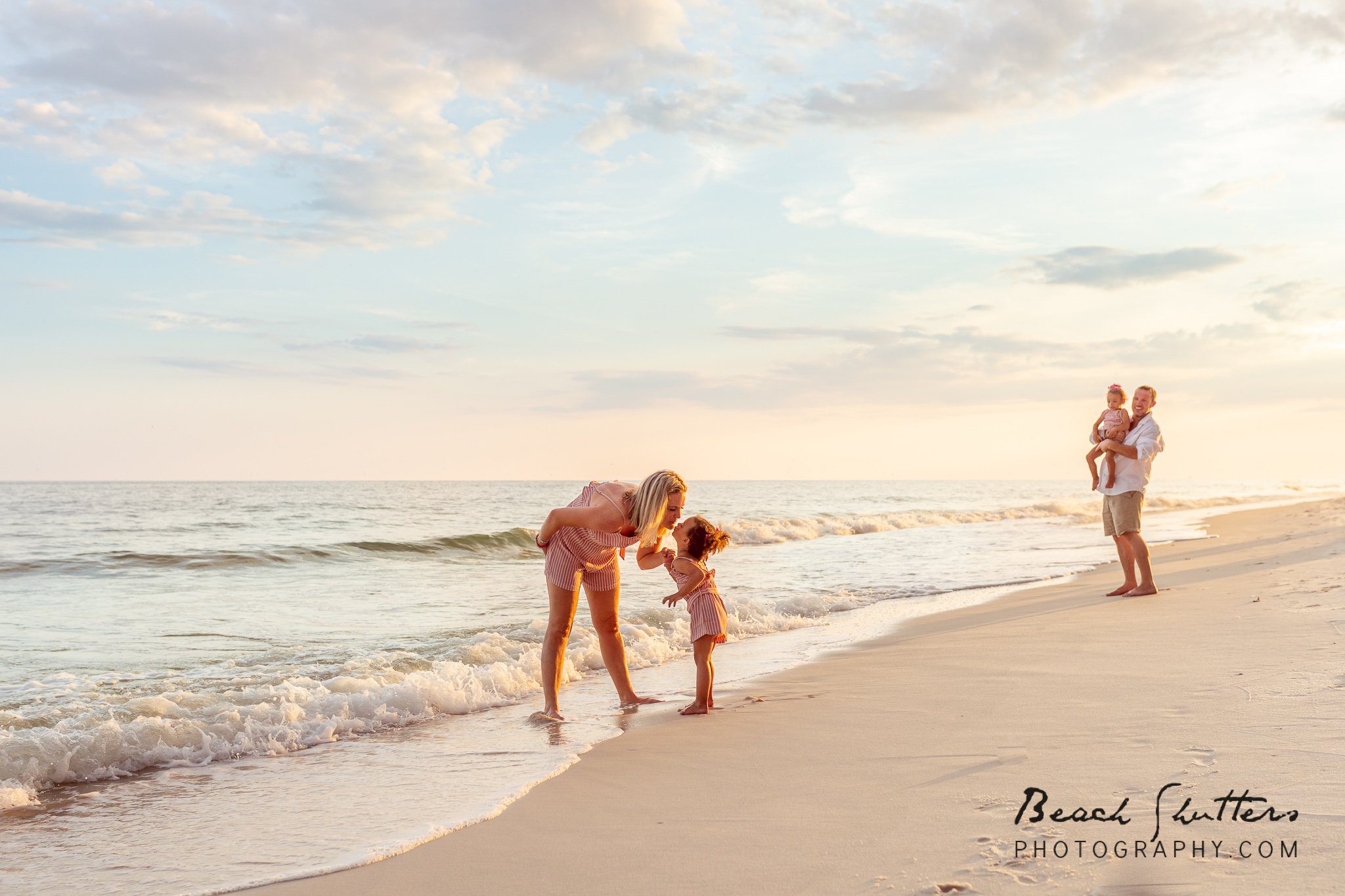 adoption photos of a family at the beach