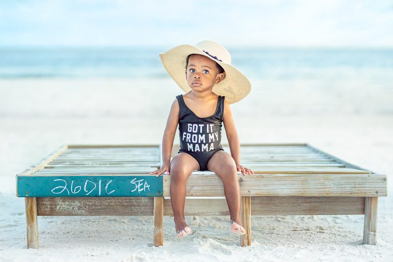 Cute Little girls at the Turquoise Place in Orange Beach. Cute little girls wearing a shirt that says "Got it from my Mama".