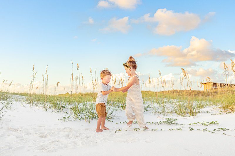 Dancing siblings Kids dancing on the beach